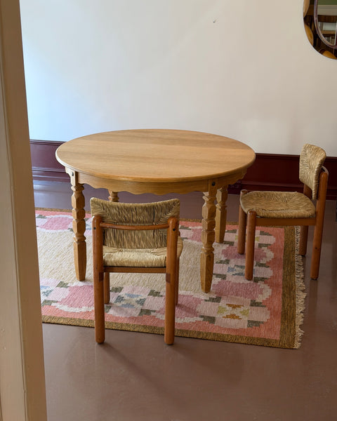 Vintage round wooden dining table with wavy/scalloped details