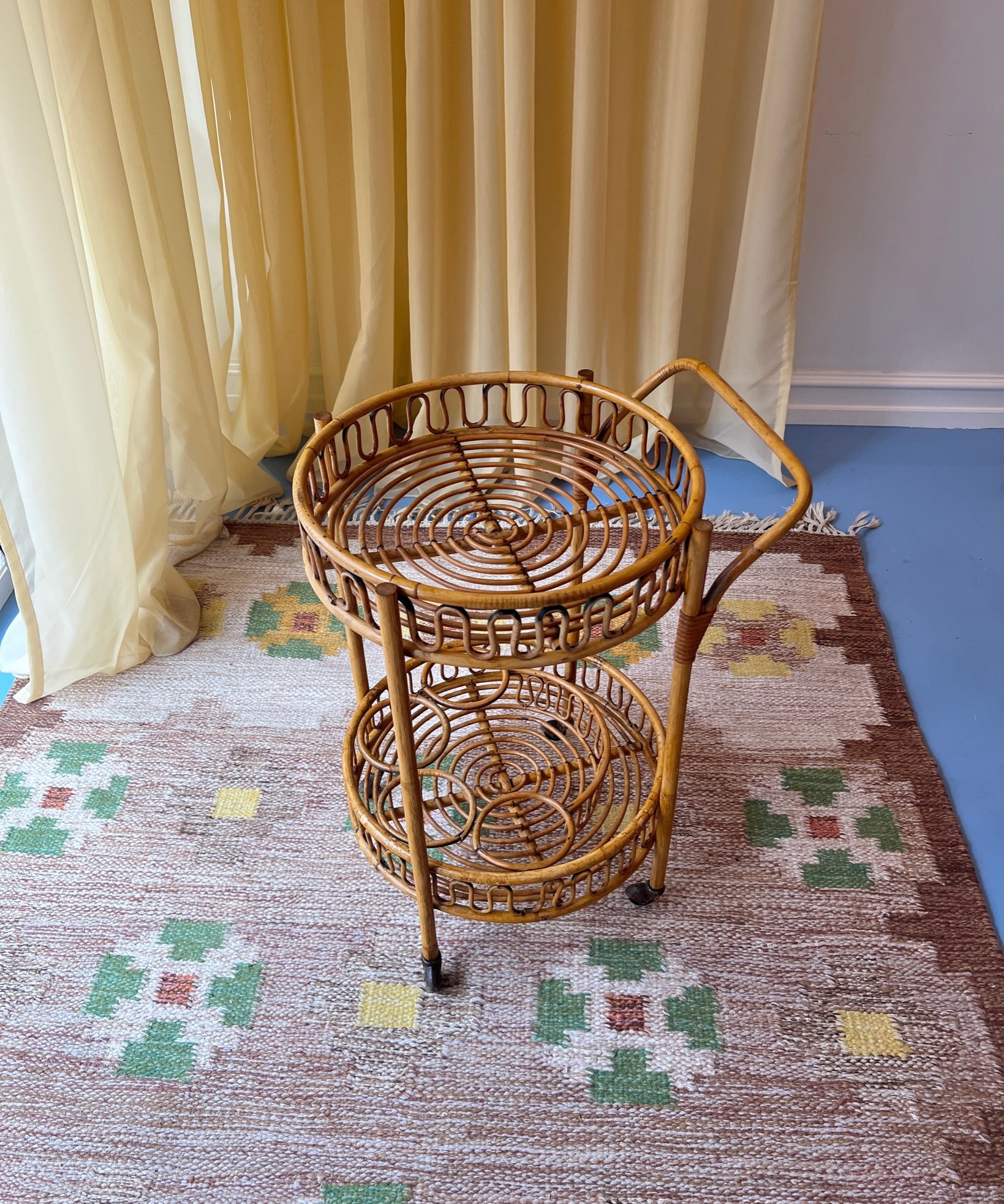 Vintage rattan table with wheels
