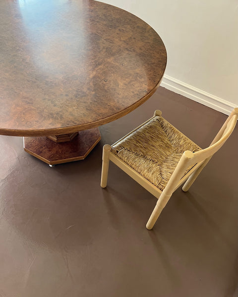 Vintage round wooden dining table with burl details