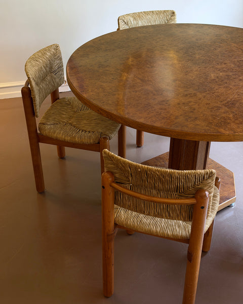 Vintage round wooden dining table with burl details
