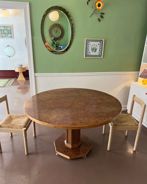 Vintage round wooden dining table with burl details