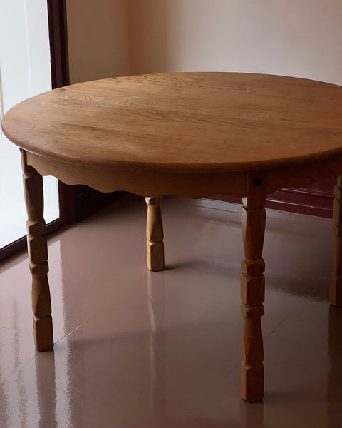 Vintage round wooden dining table with wavy/scalloped details