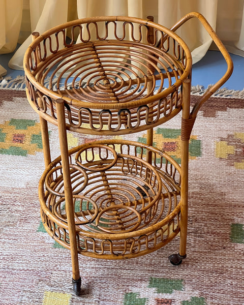 Vintage rattan table with wheels