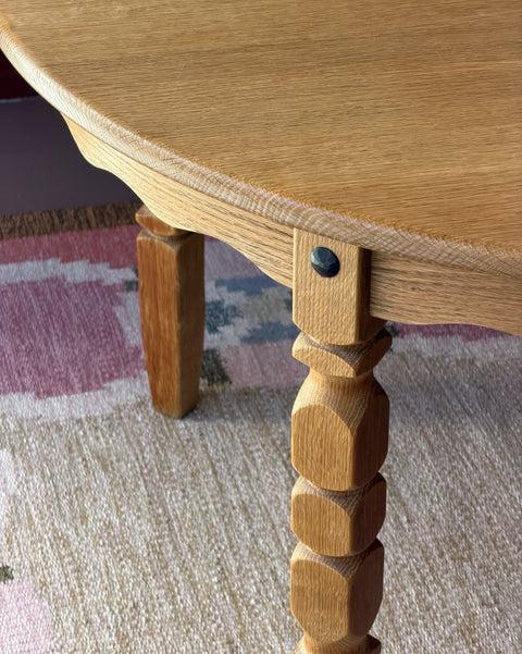 Vintage round wooden dining table with wavy/scalloped details
