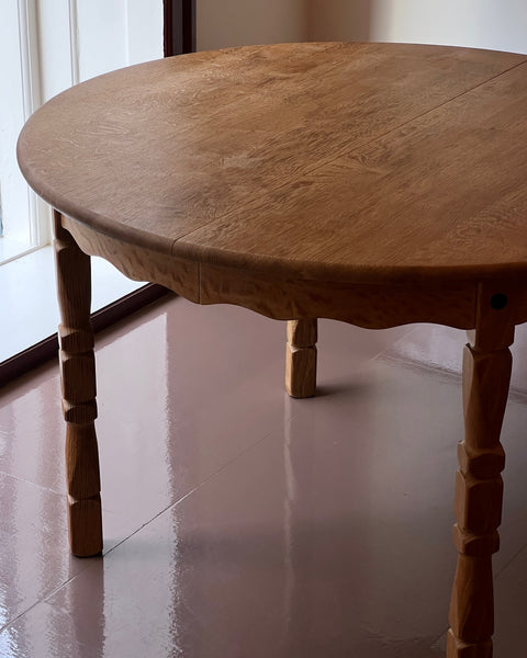 Vintage round wooden dining table with wavy/scalloped details