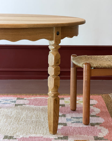 Vintage round wooden dining table with wavy/scalloped details