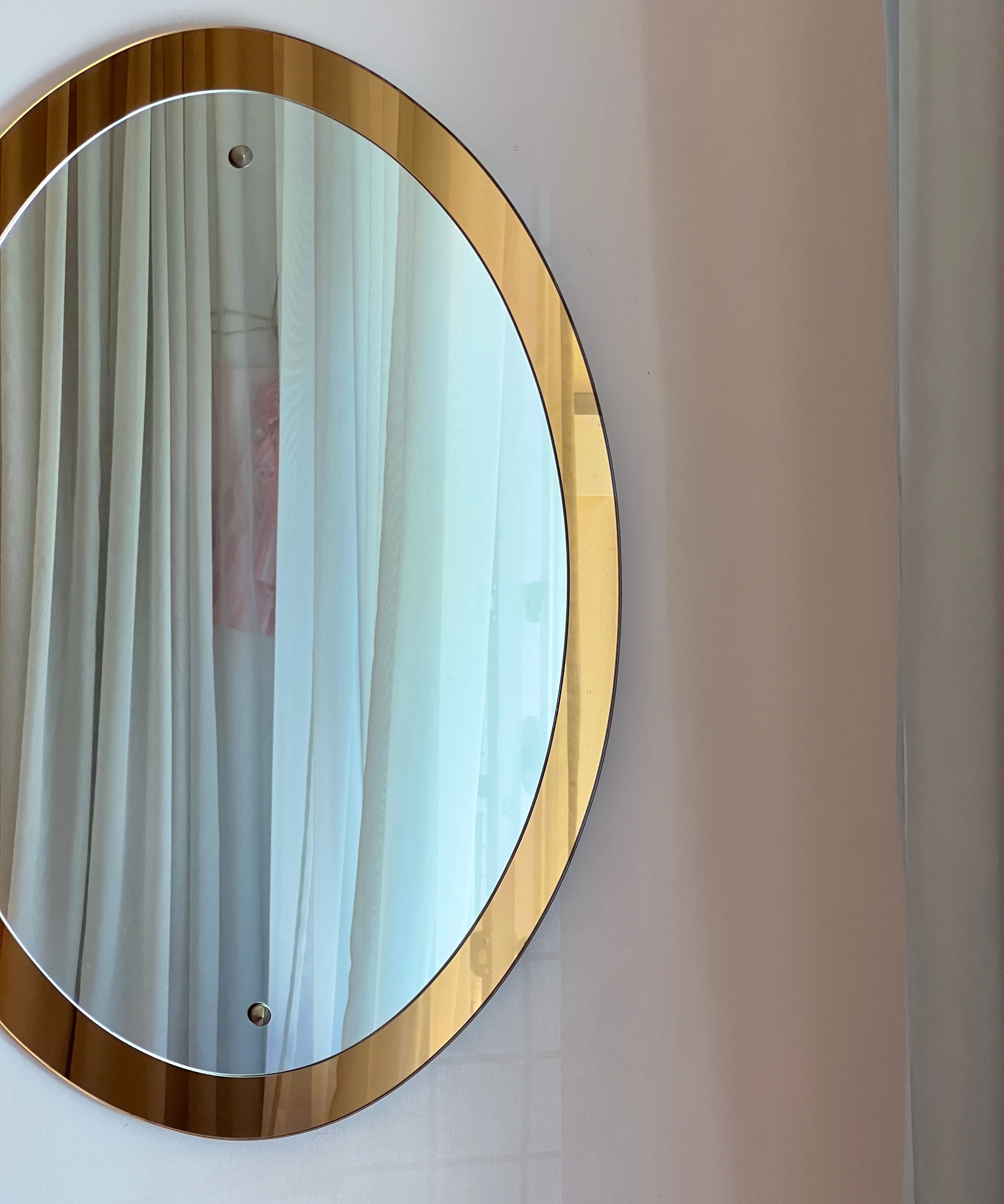 Vintage oval golden Italian mirror