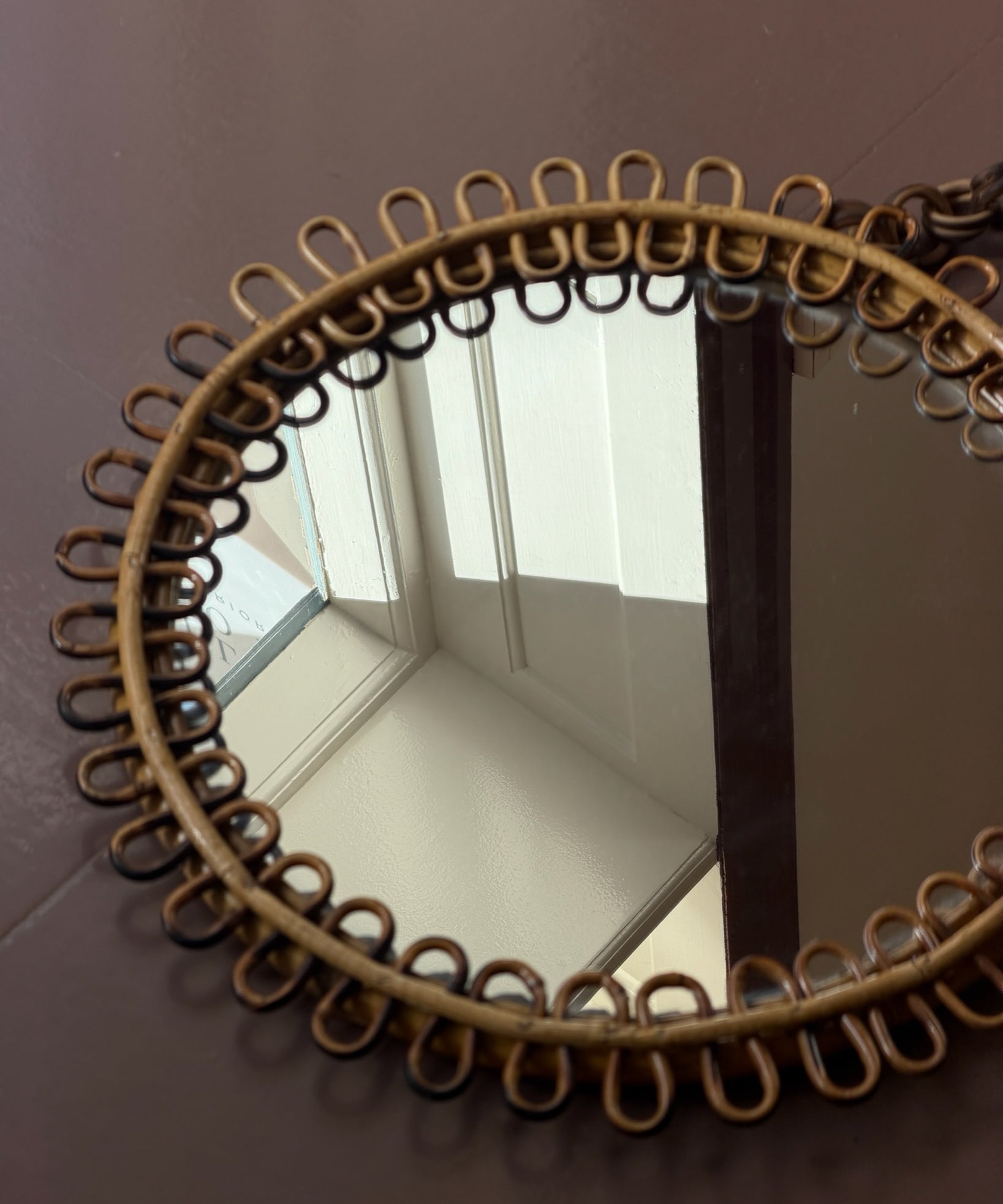 Vintage Italian round mirror with rattan frame