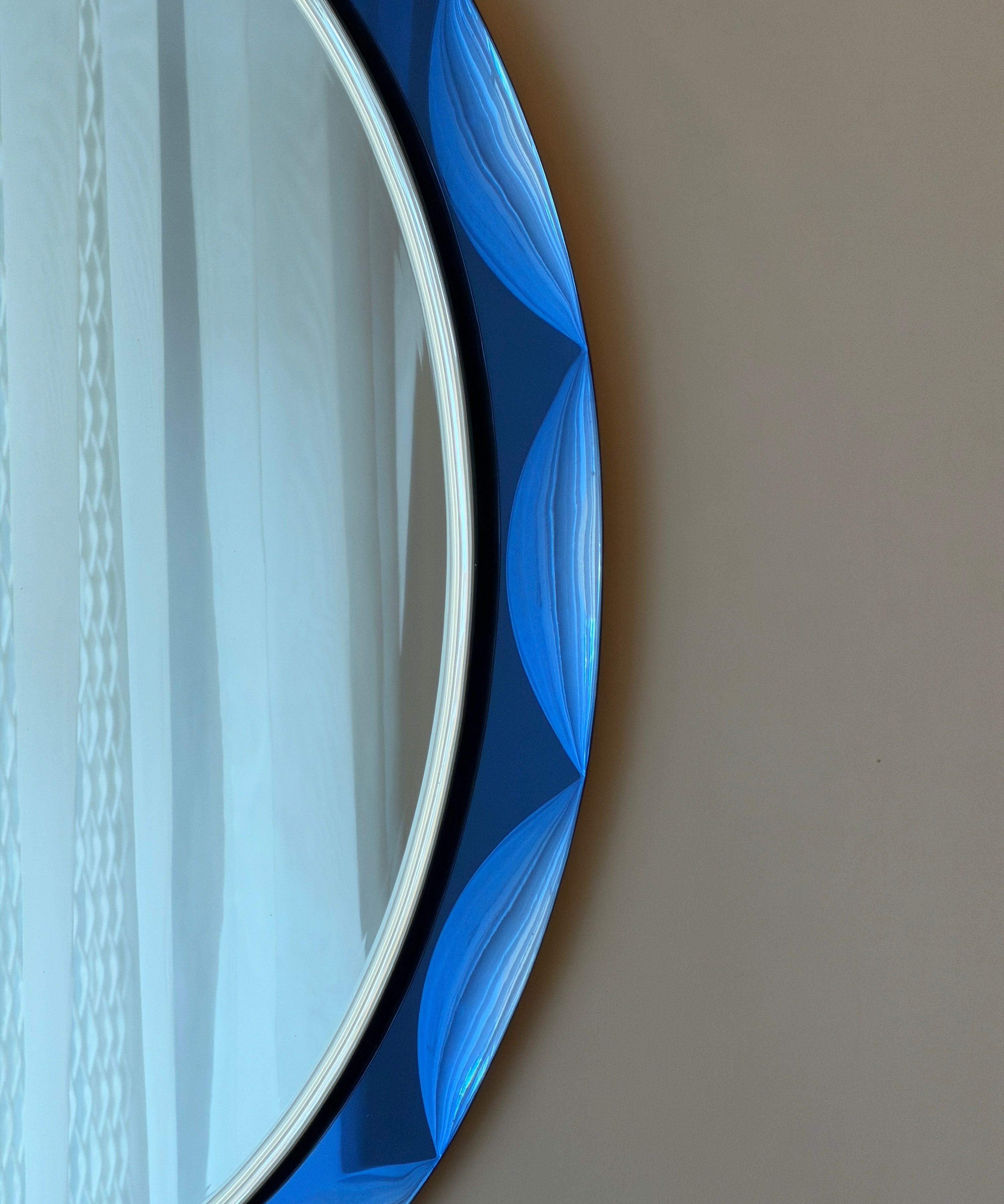 Vintage Italian mirror with faceted blue mirror frame