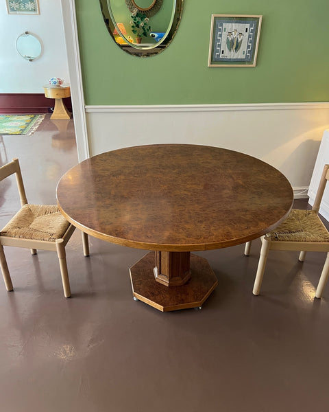 Vintage round wooden dining table with burl details