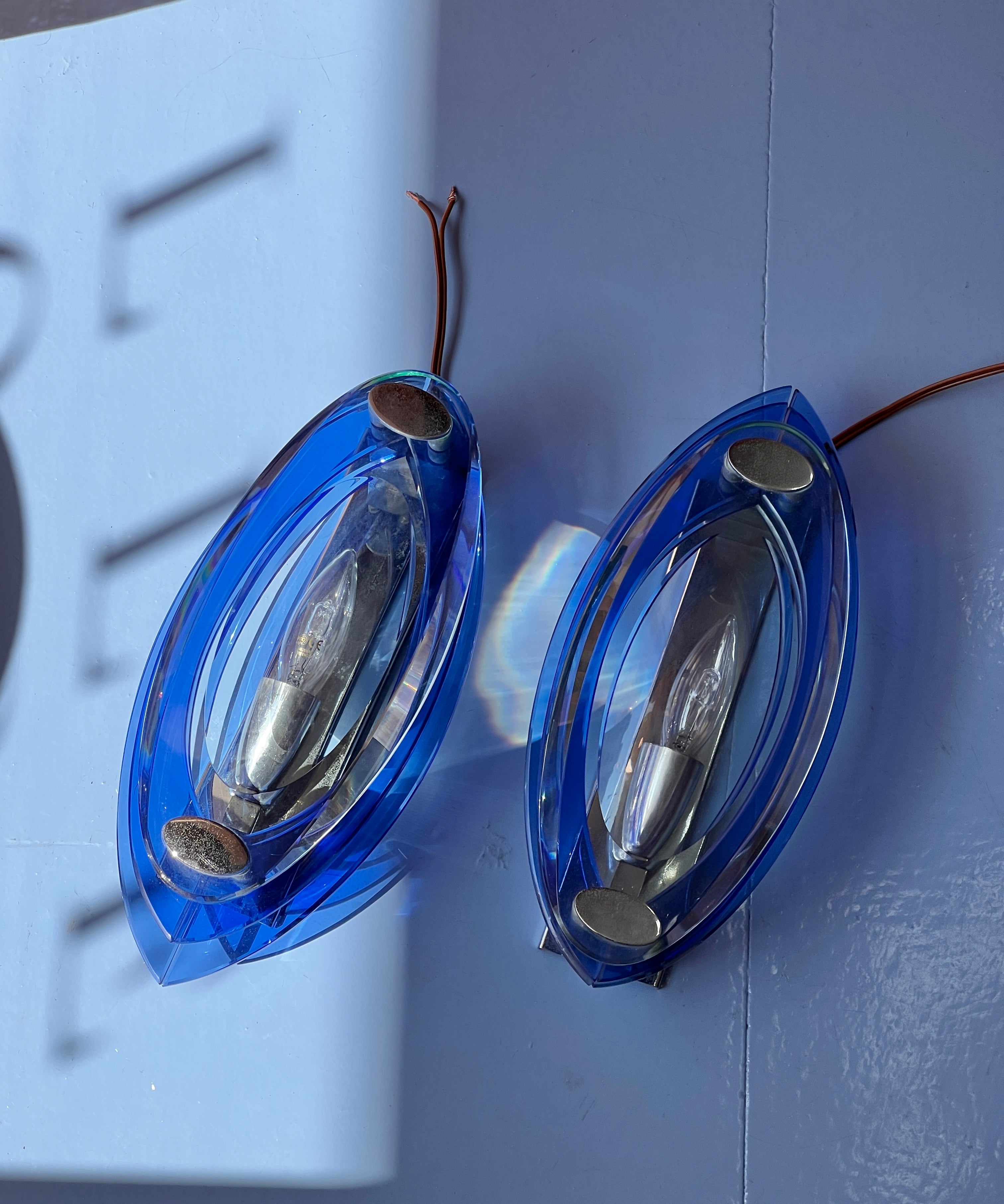 Vintage blue/clear pair of glass wall lamps