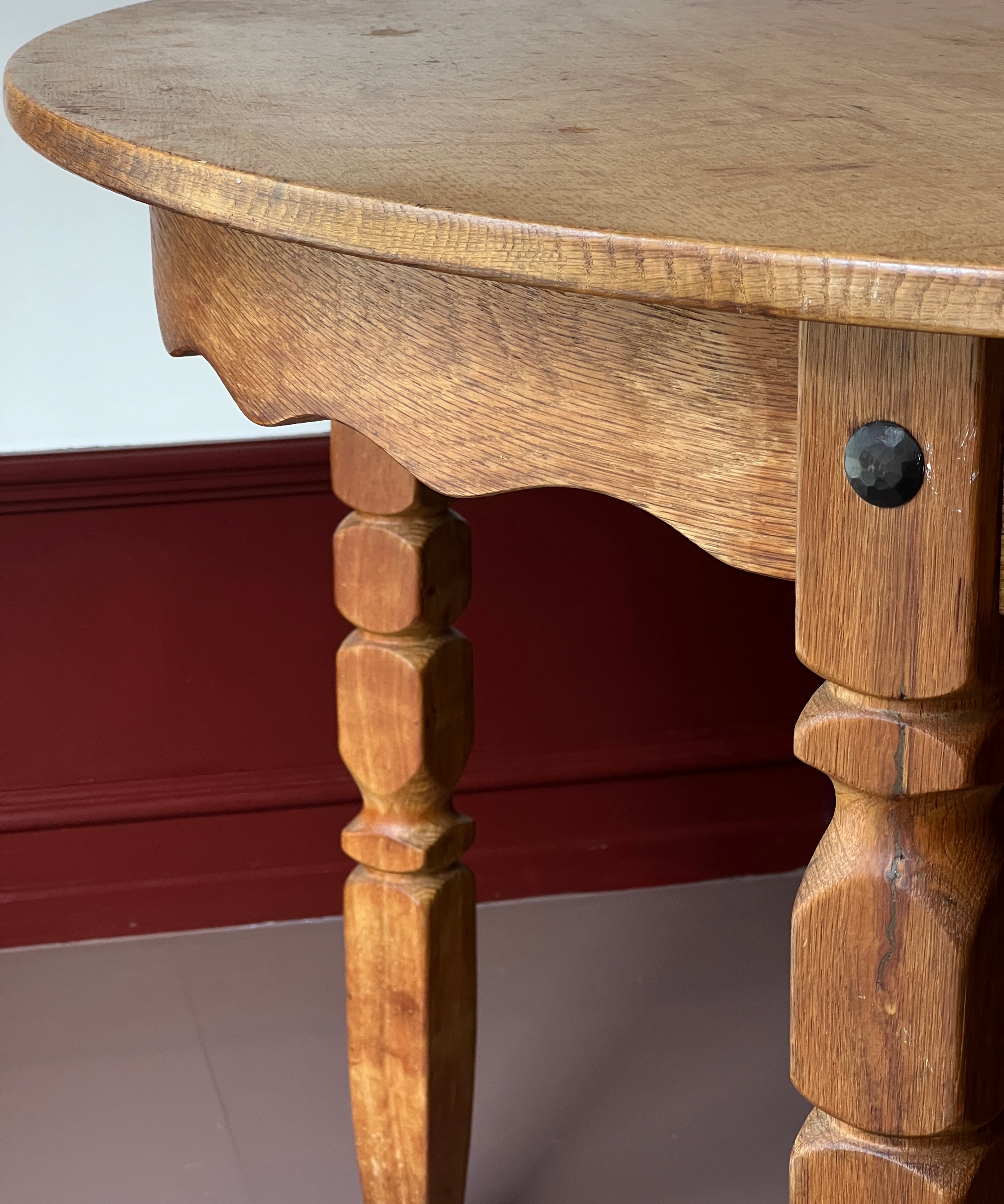 Vintage round wooden dining table with wavy/scalloped details
