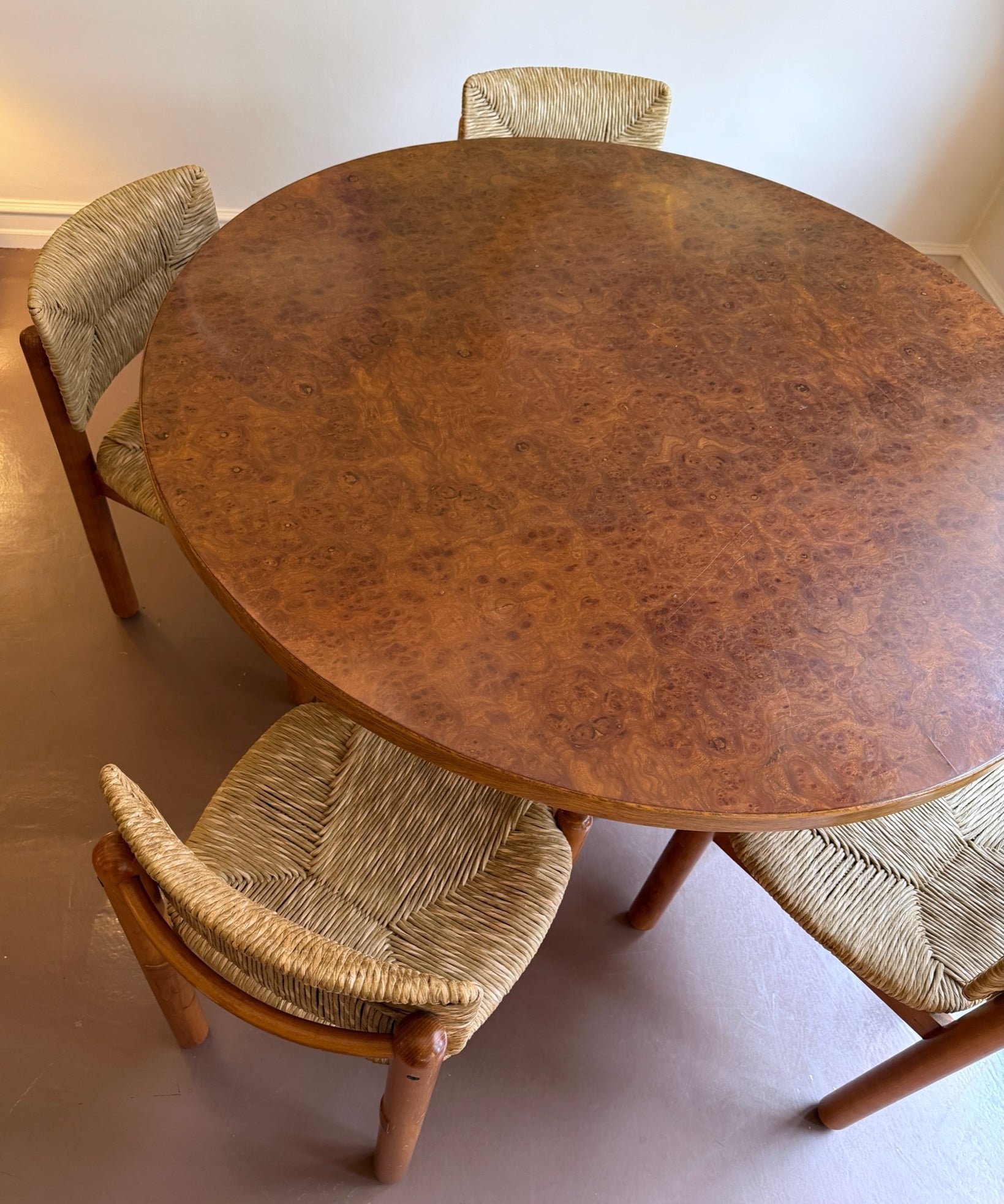 Vintage round wooden dining table with burl details