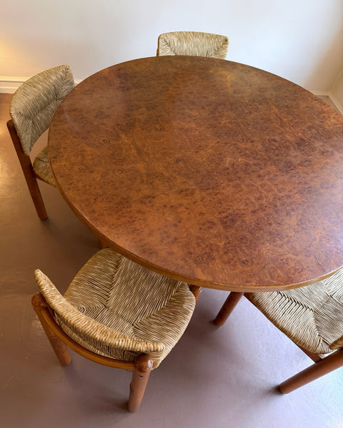 Vintage round wooden dining table with burl details