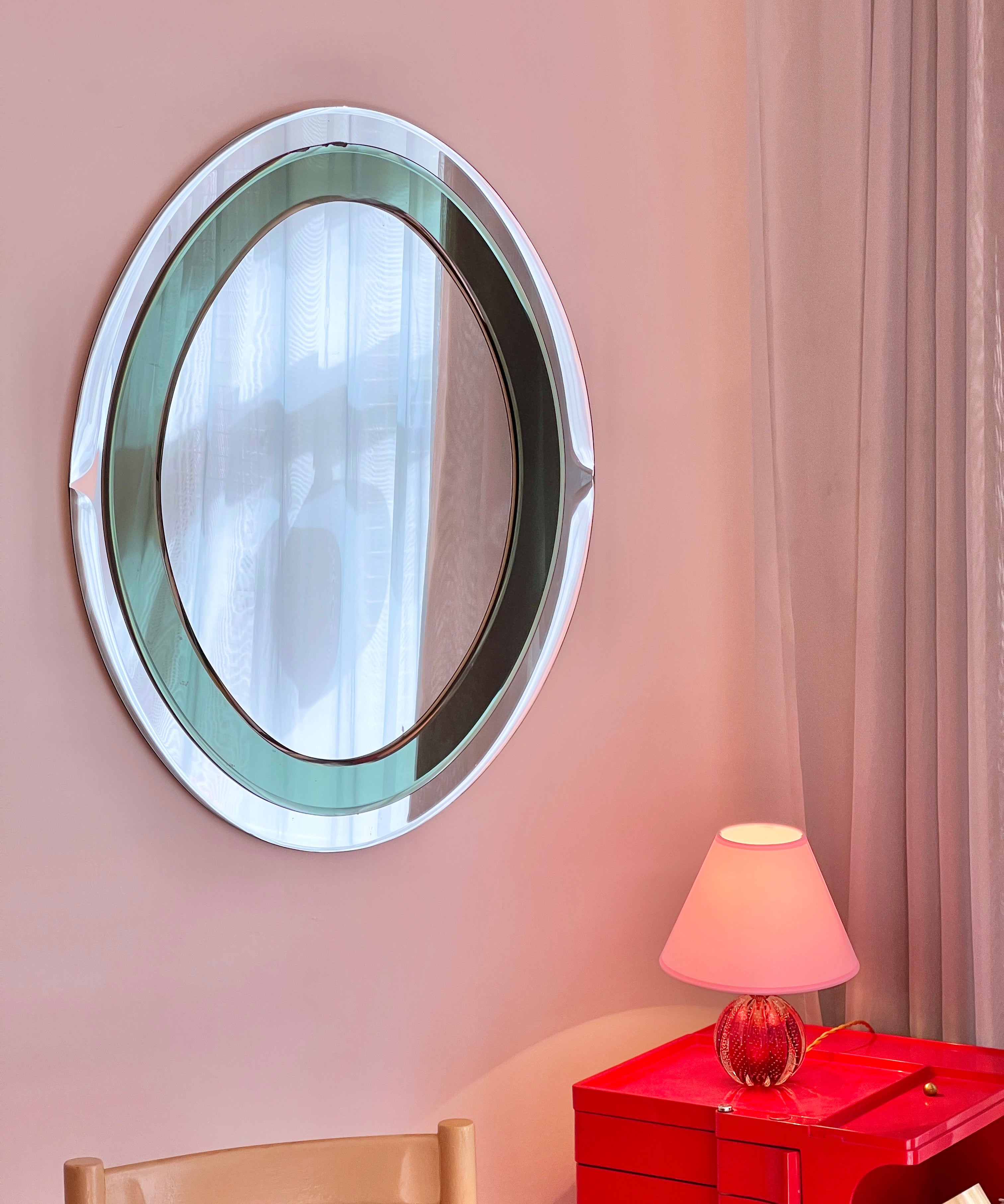 Vintage oval Italian mirror with green and facetted mirror frame