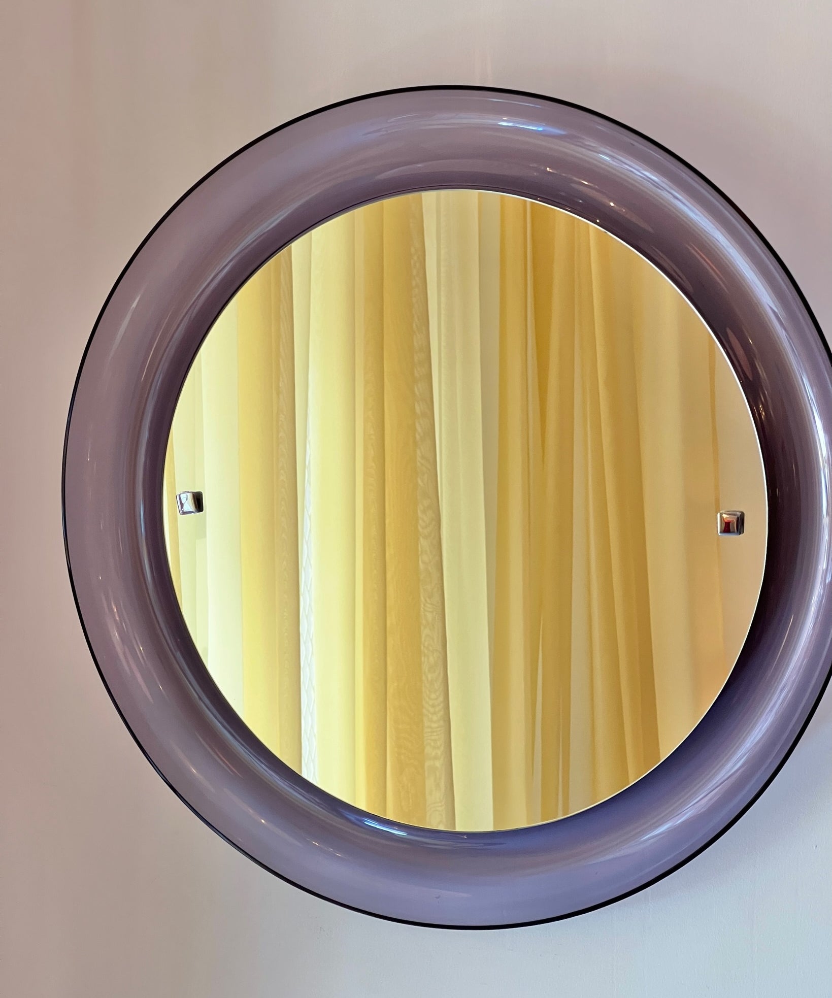 Round vintage Italian mirror with purple plastic frame