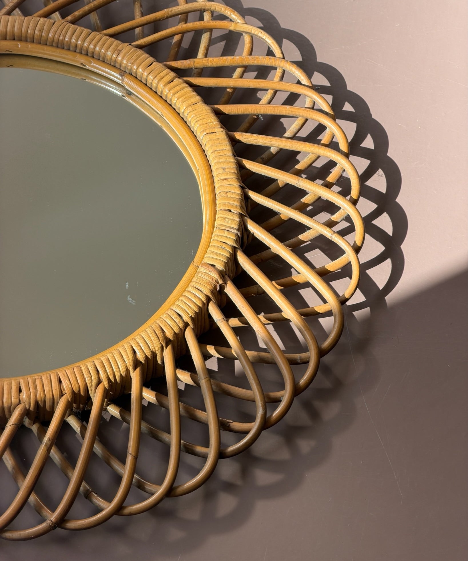 Vintage Italian round mirror with rattan frame