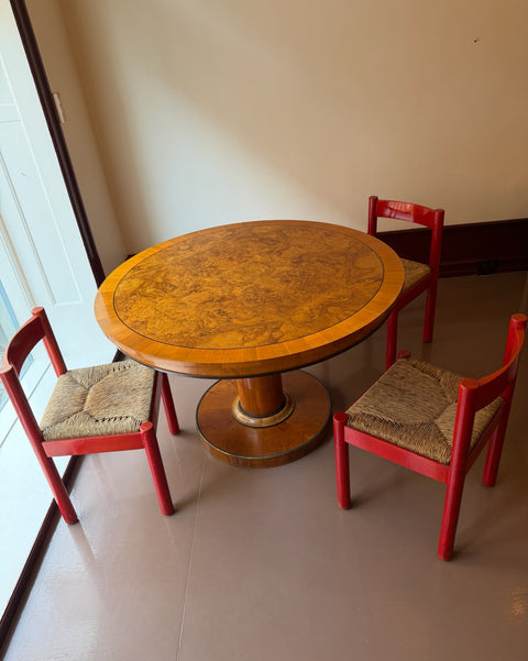 Vintage round wooden dining table with burl details