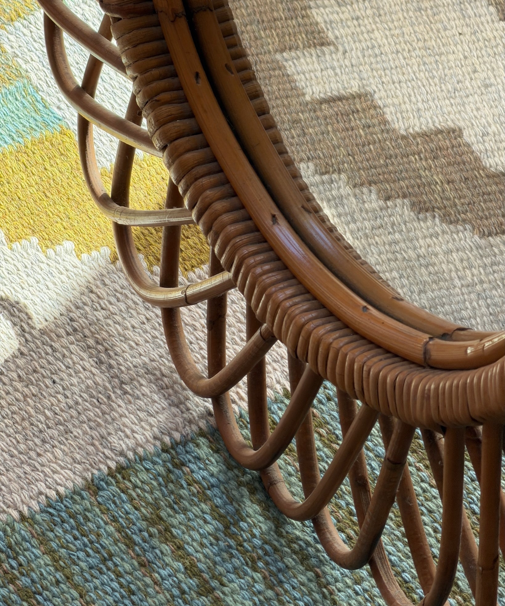 Vintage Italian round mirror with rattan frame