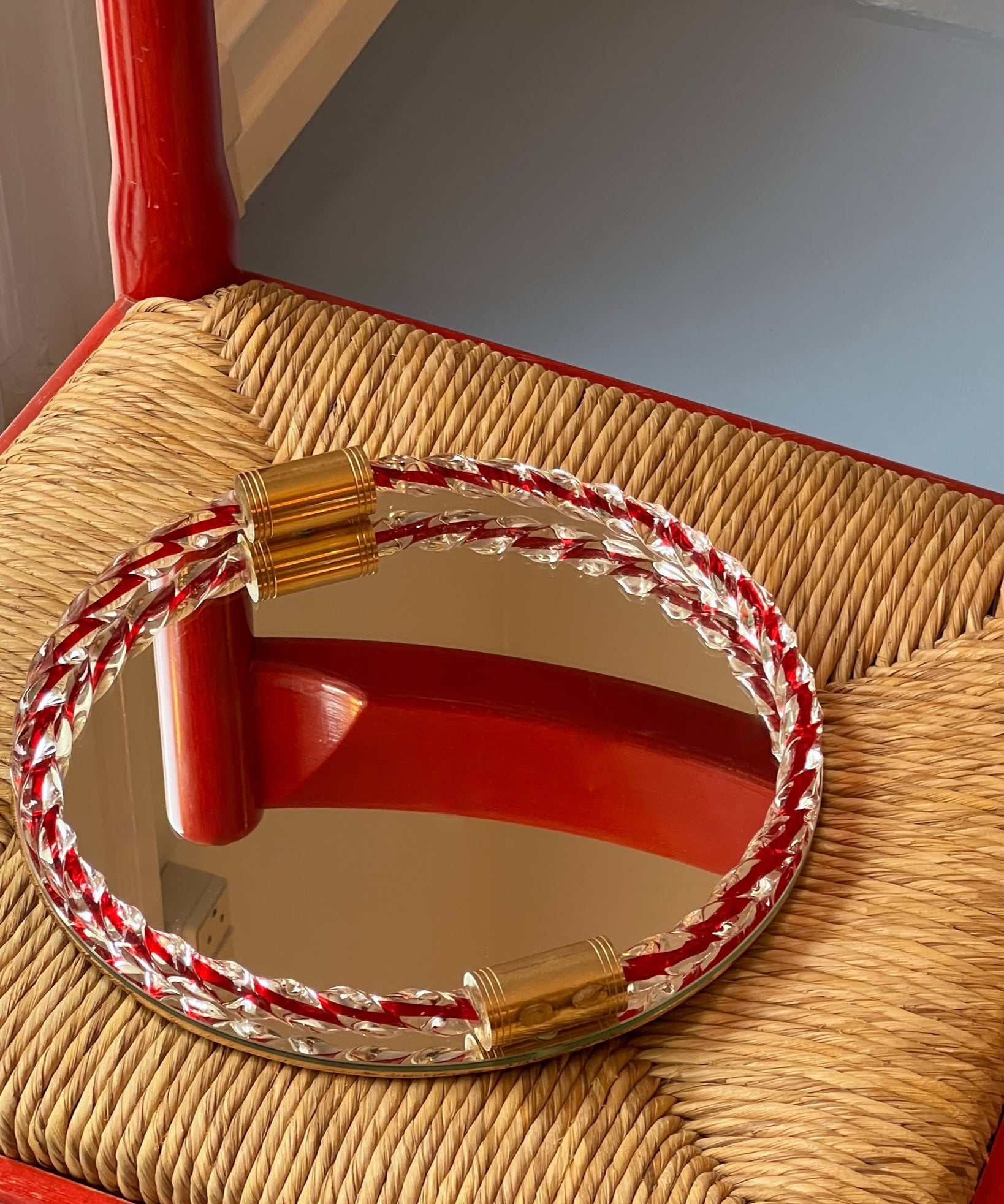 Vintage Italian mirror with twisted clear/red glass frame