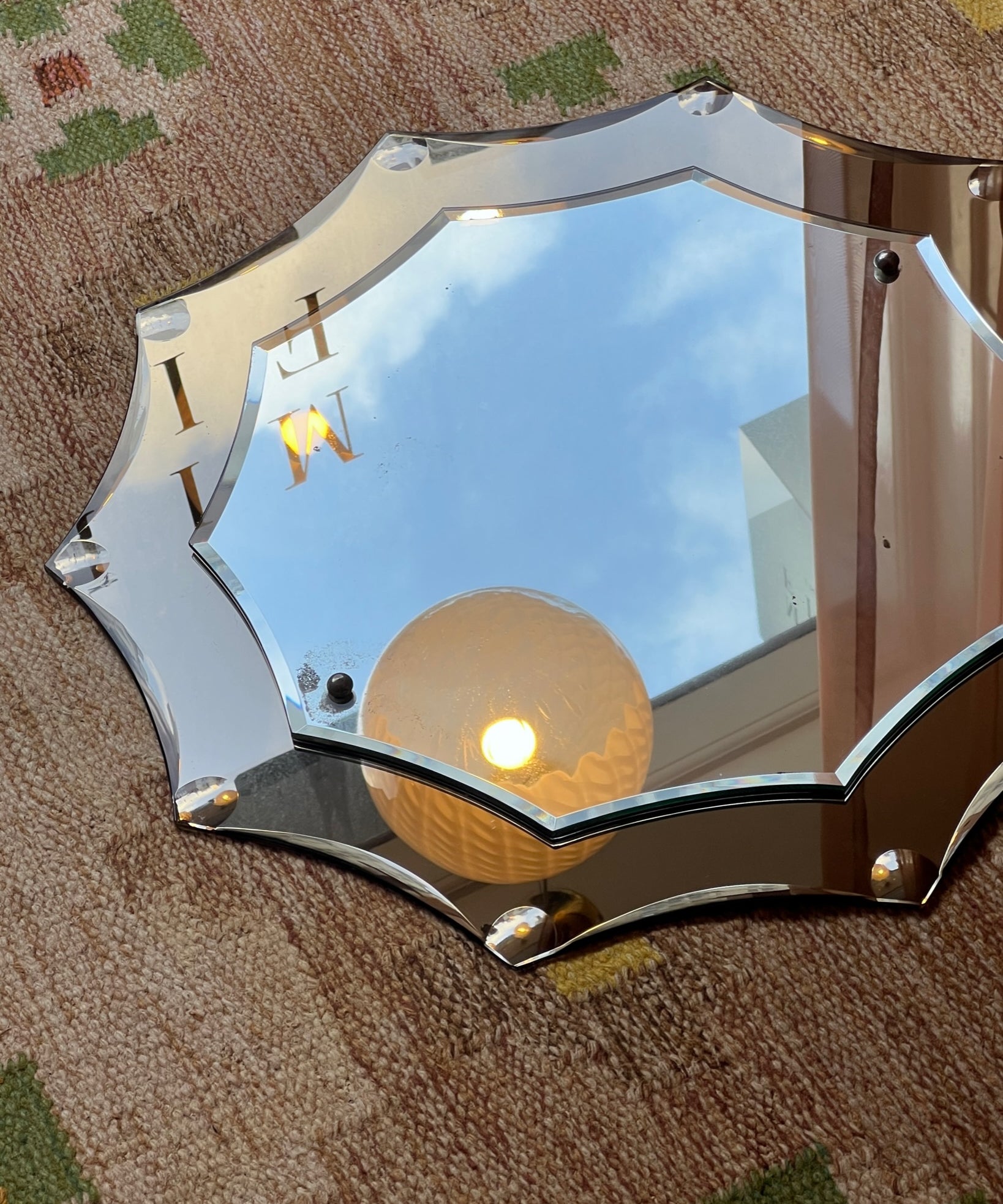 Vintage Italian mirror with golden brown faceted mirror frame