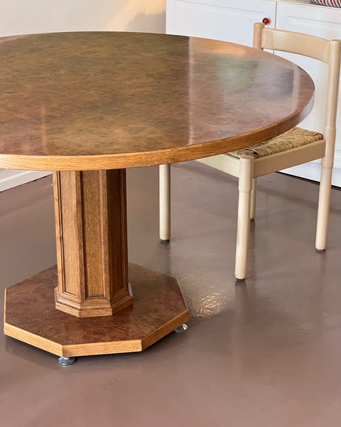 Vintage round wooden dining table with burl details