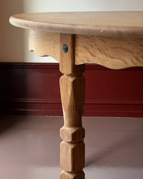 Vintage round wooden dining table with wavy/scalloped details