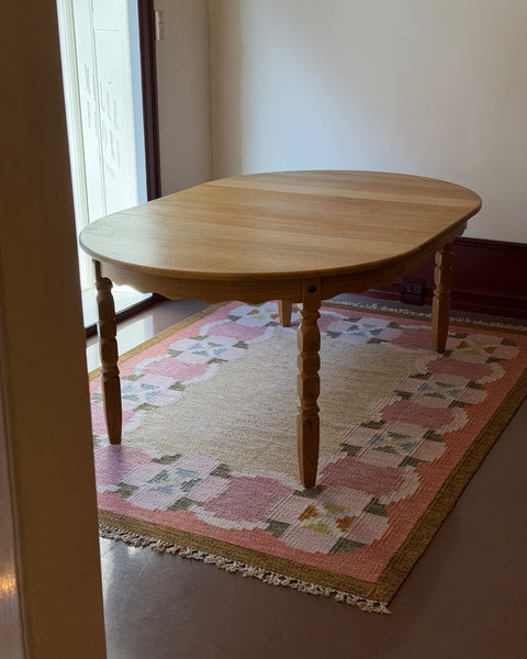 Vintage round wooden dining table with wavy/scalloped details