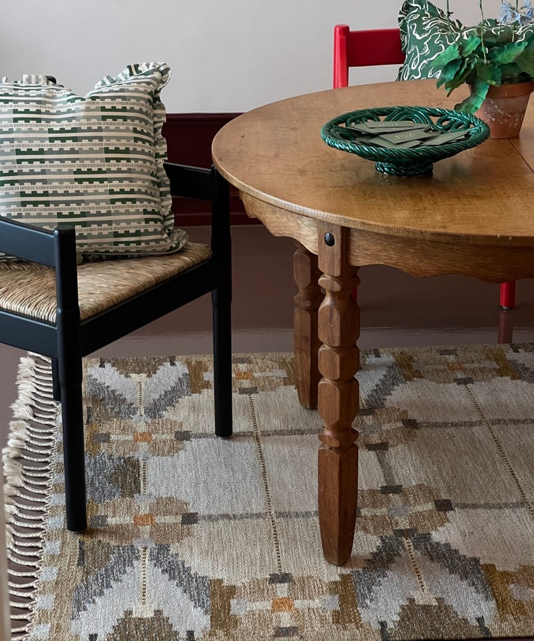Vintage round wooden dining table with wavy/scalloped details