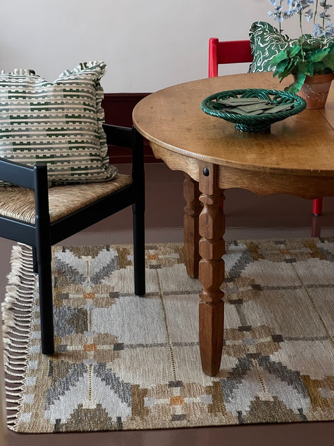 Vintage round wooden dining table with wavy/scalloped details