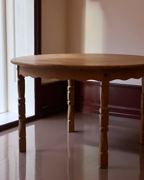 Vintage round wooden dining table with wavy/scalloped details