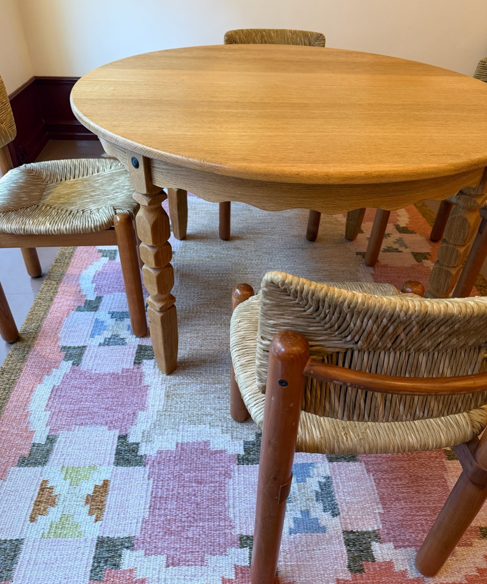 Vintage round wooden dining table with wavy/scalloped details