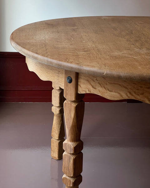 Vintage round wooden dining table with wavy/scalloped details