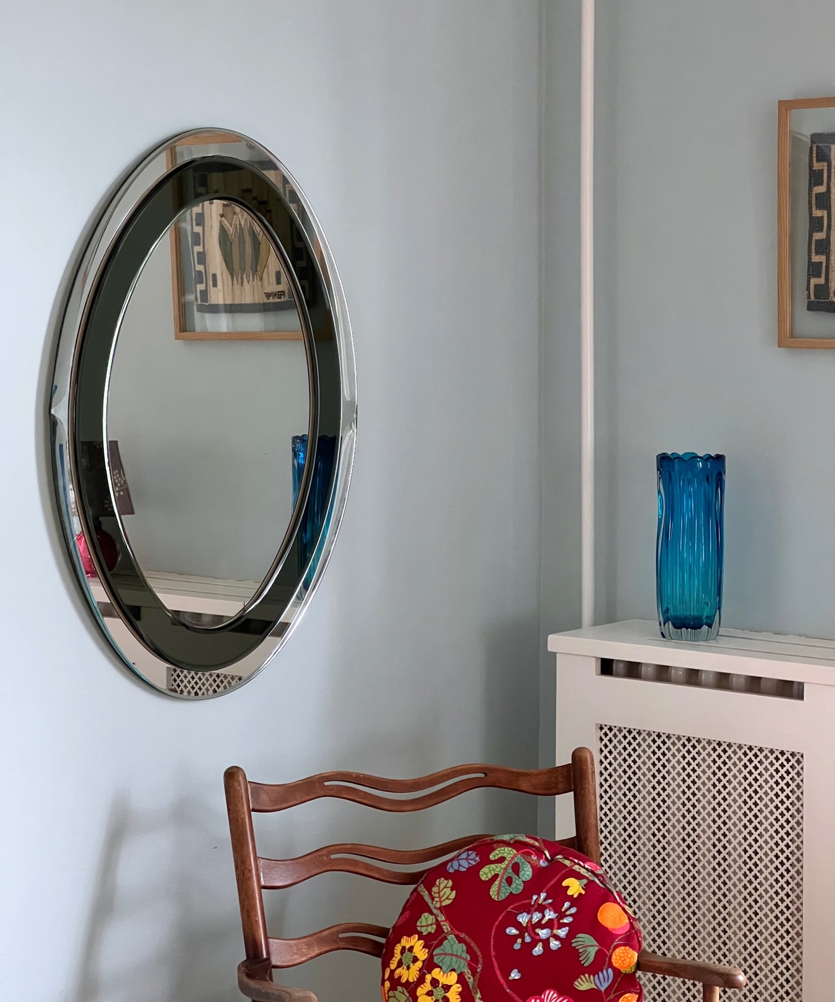 Vintage oval Italian mirror with green and facetted mirror frame