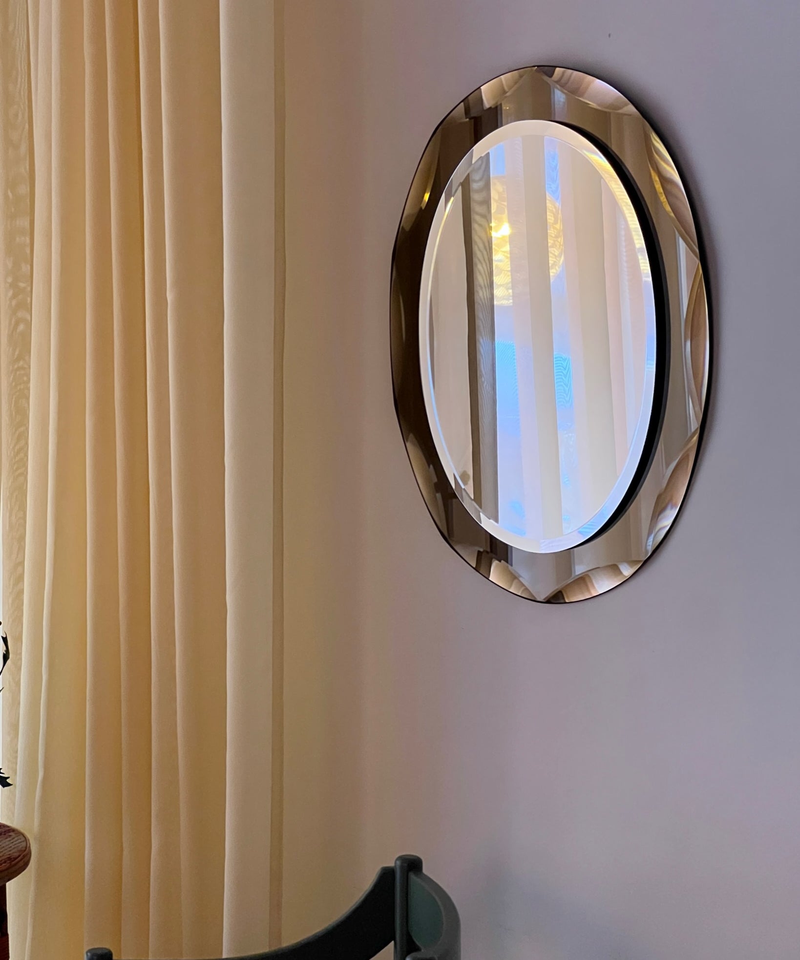 Vintage Italian mirror with golden brown faceted mirror frame