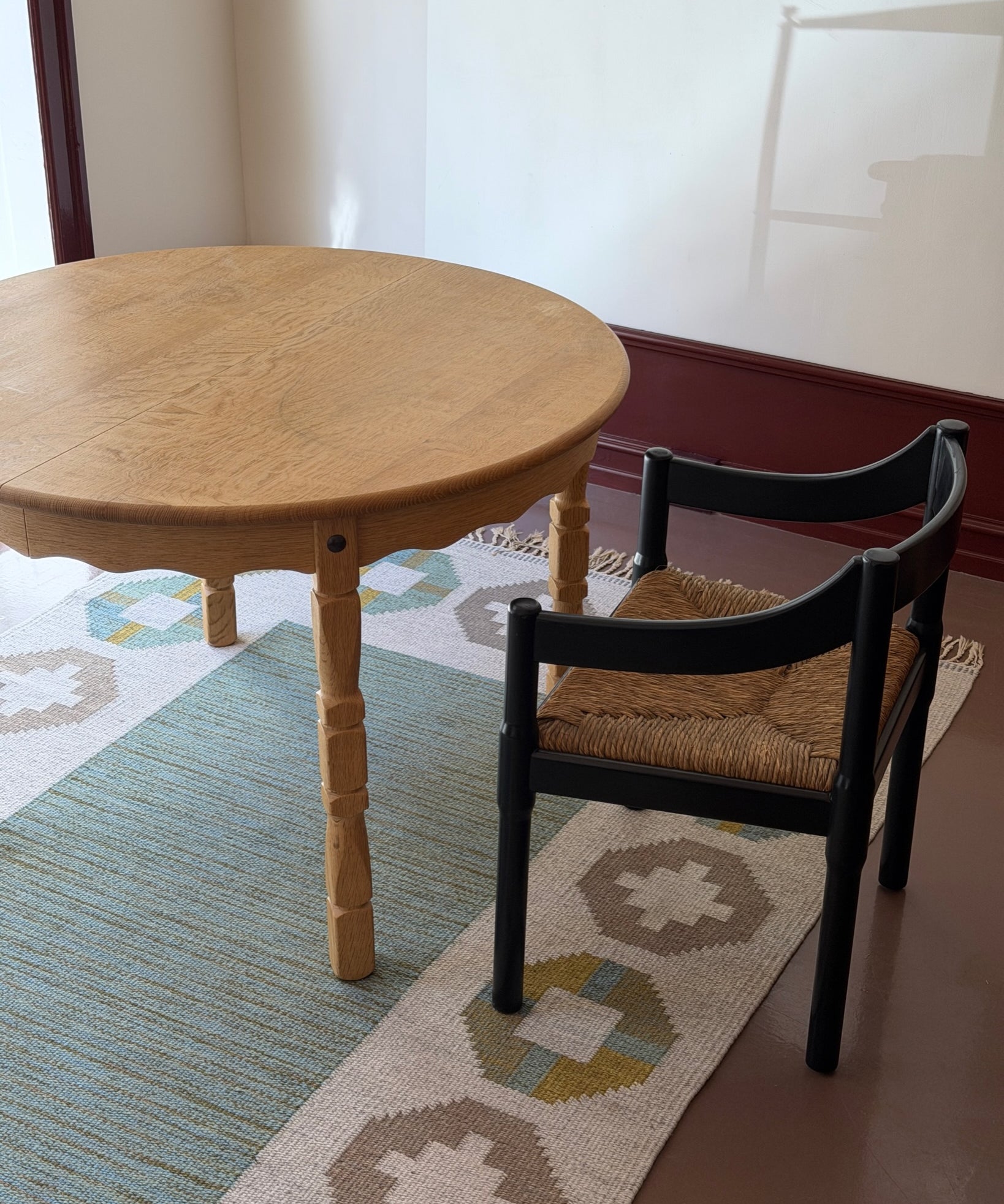 Vintage round wooden dining table with wavy/scalloped details