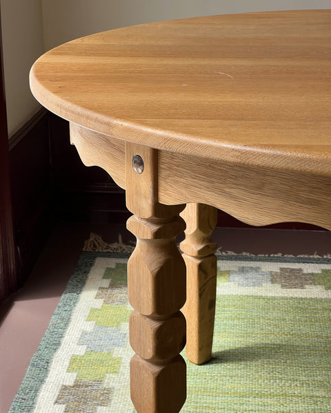 Vintage round wooden dining table with wavy/scalloped details