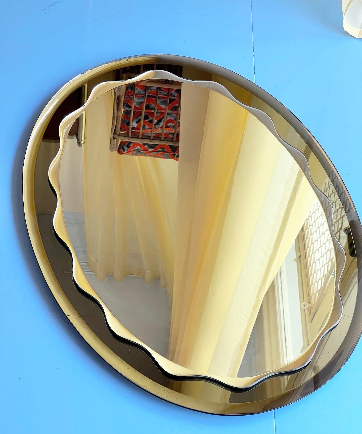 Vintage Italian mirror with smoked brown scalloped frame