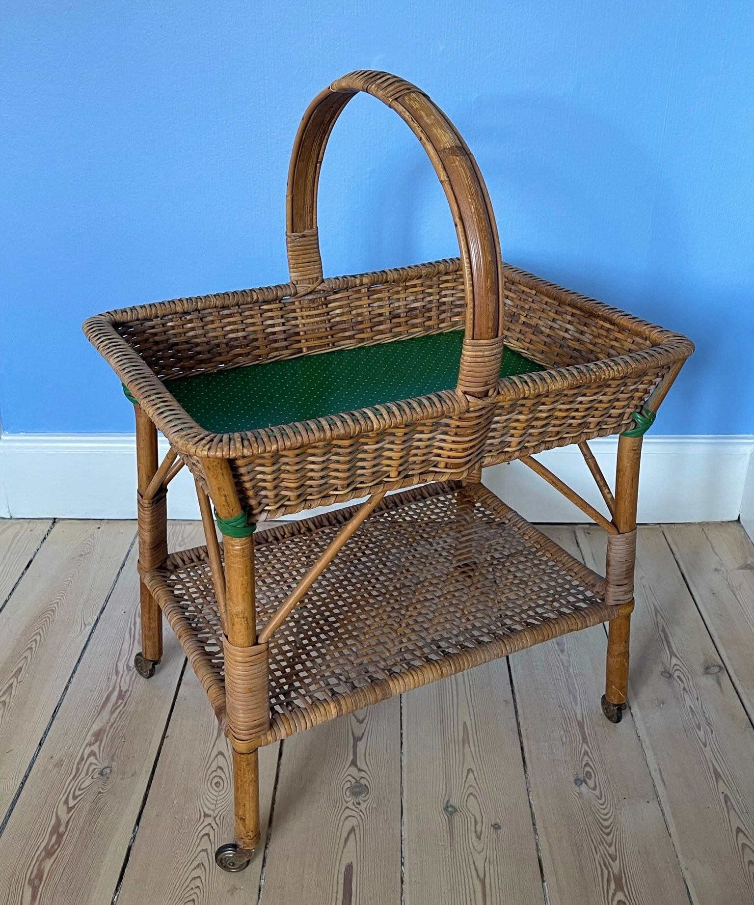 Vintage rattan table with wheels
