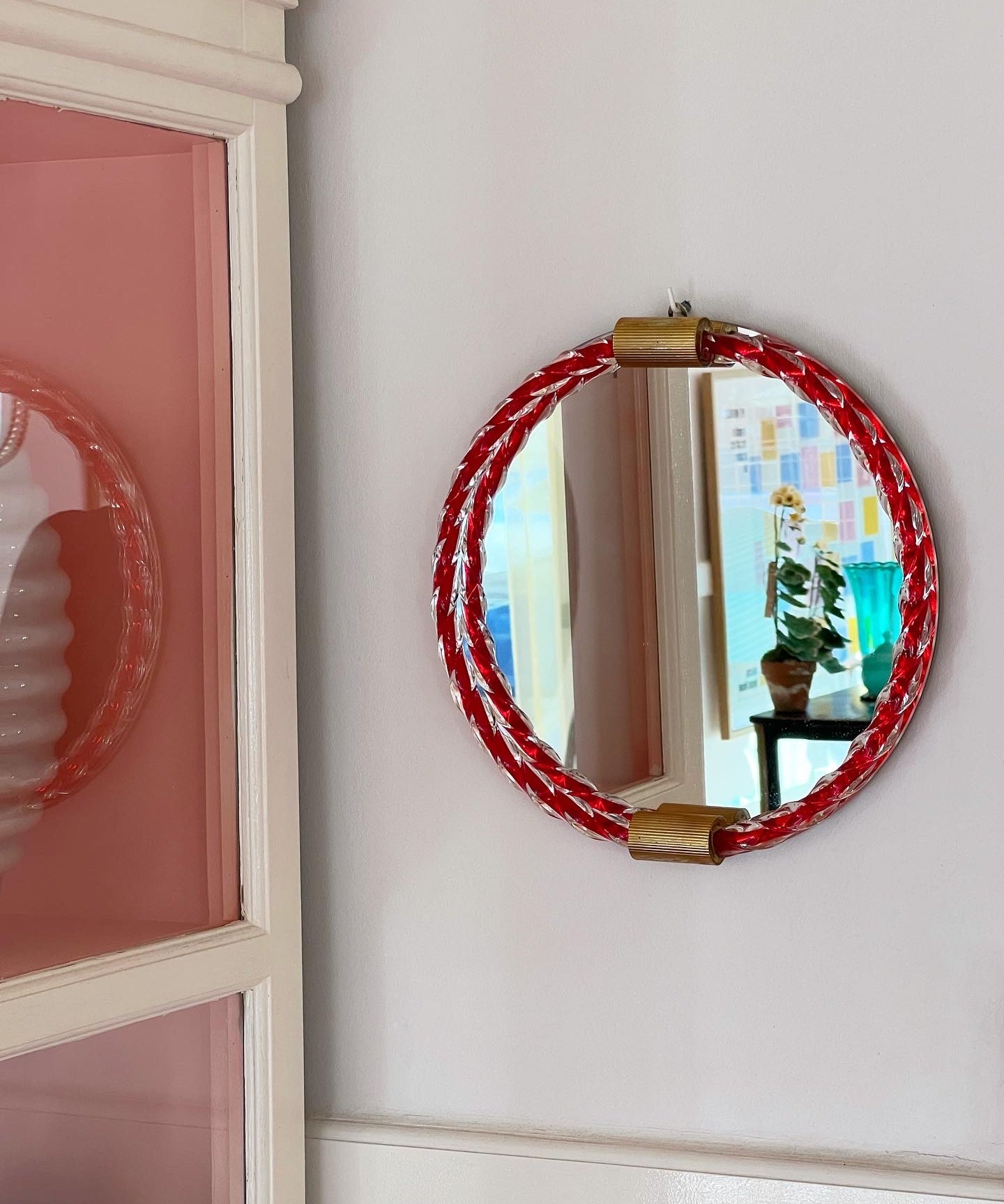 Vintage Italian mirror with twisted red glass frame