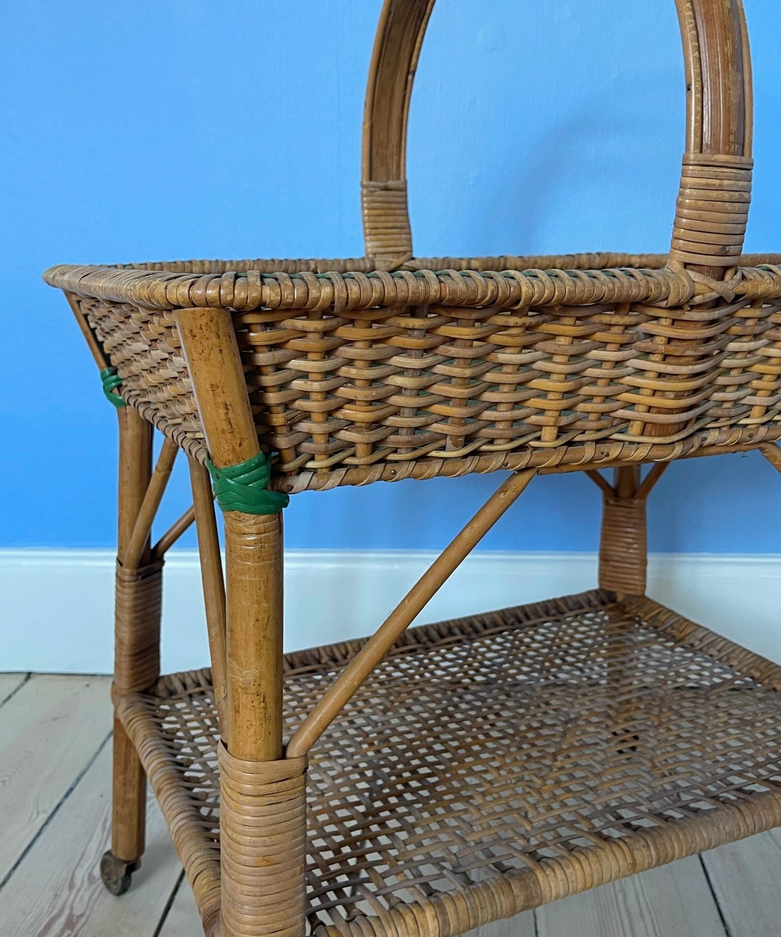 Vintage rattan table with wheels