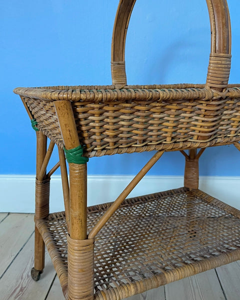 Vintage rattan table with wheels