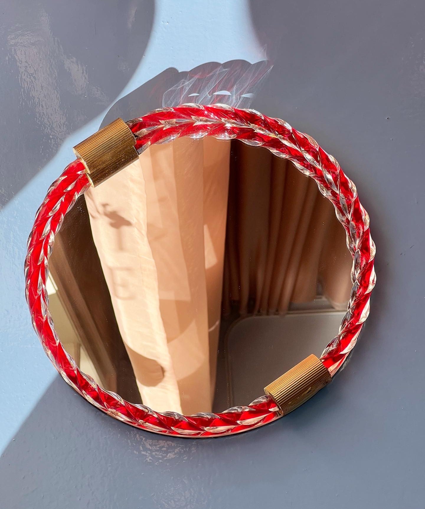 Vintage Italian mirror with twisted red glass frame