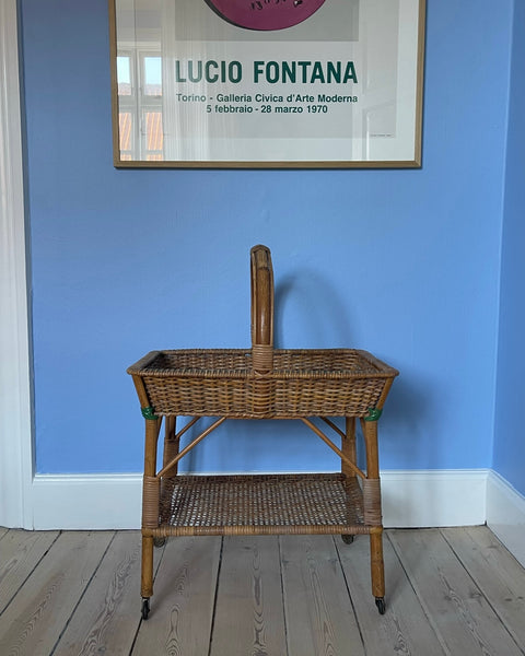 Vintage rattan table with wheels