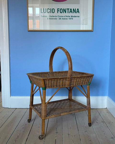 Vintage rattan table with wheels