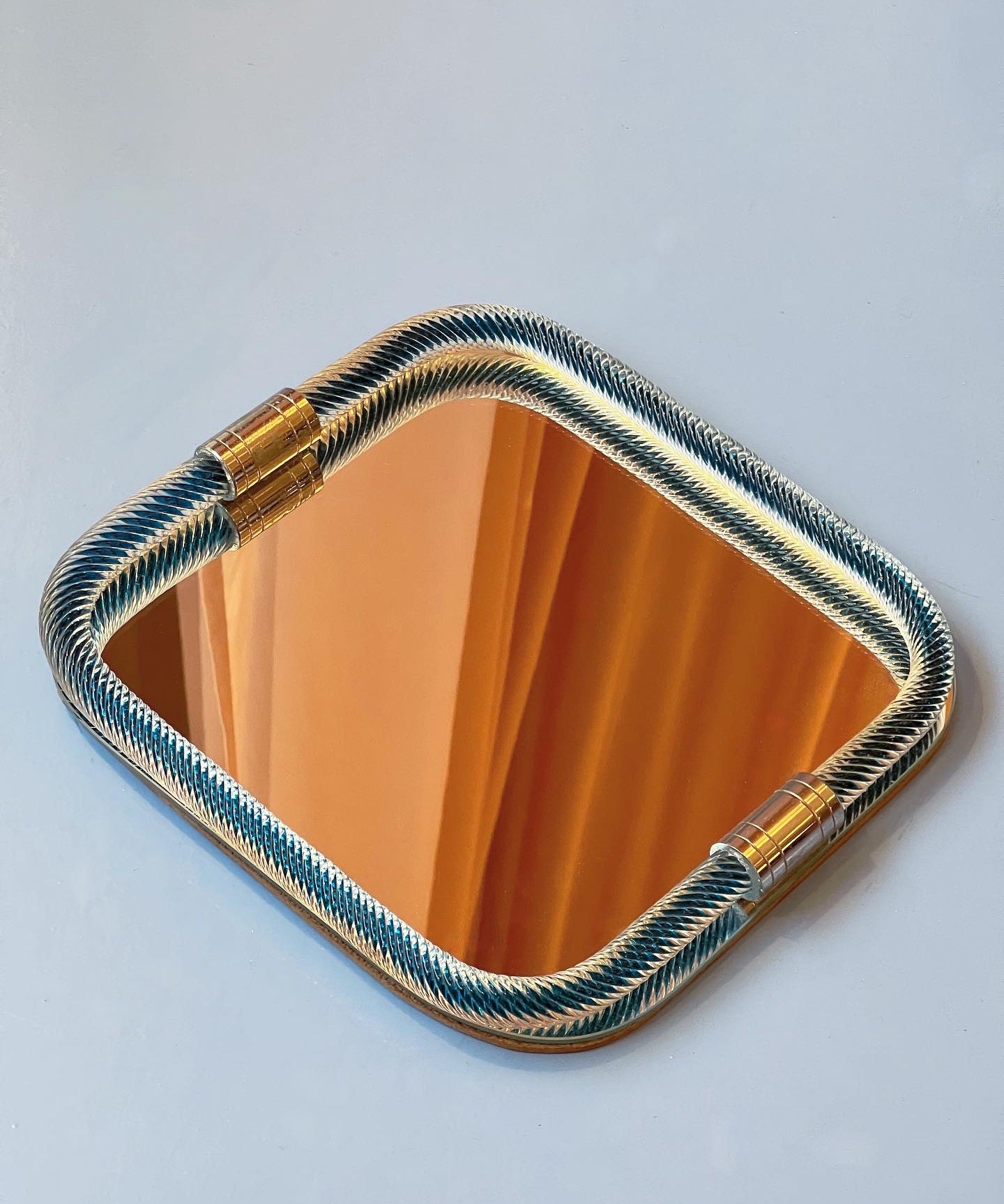Vintage Italian mirror with twisted blue glass frame