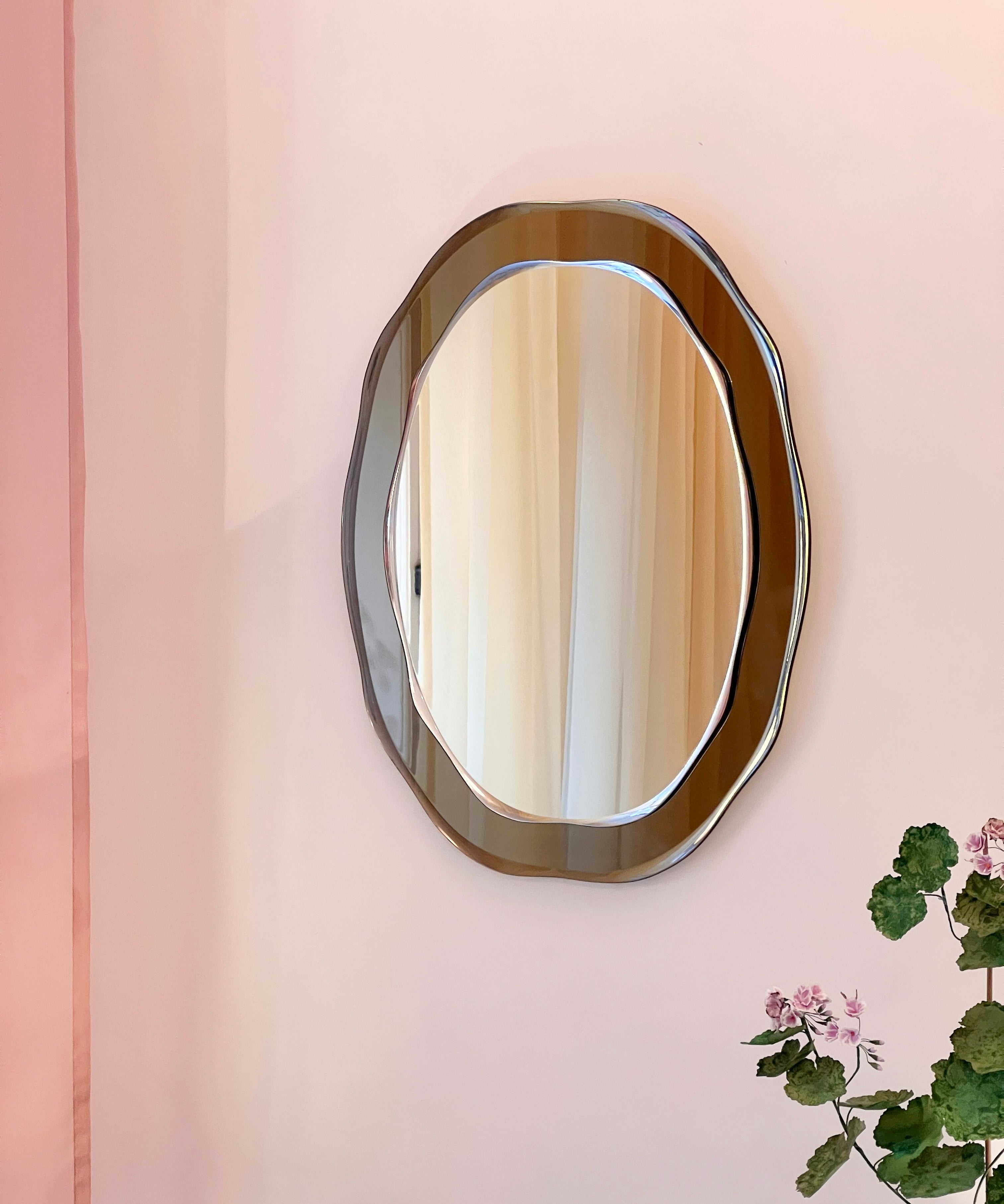 Vintage Italian mirror with wavy golden brown frame