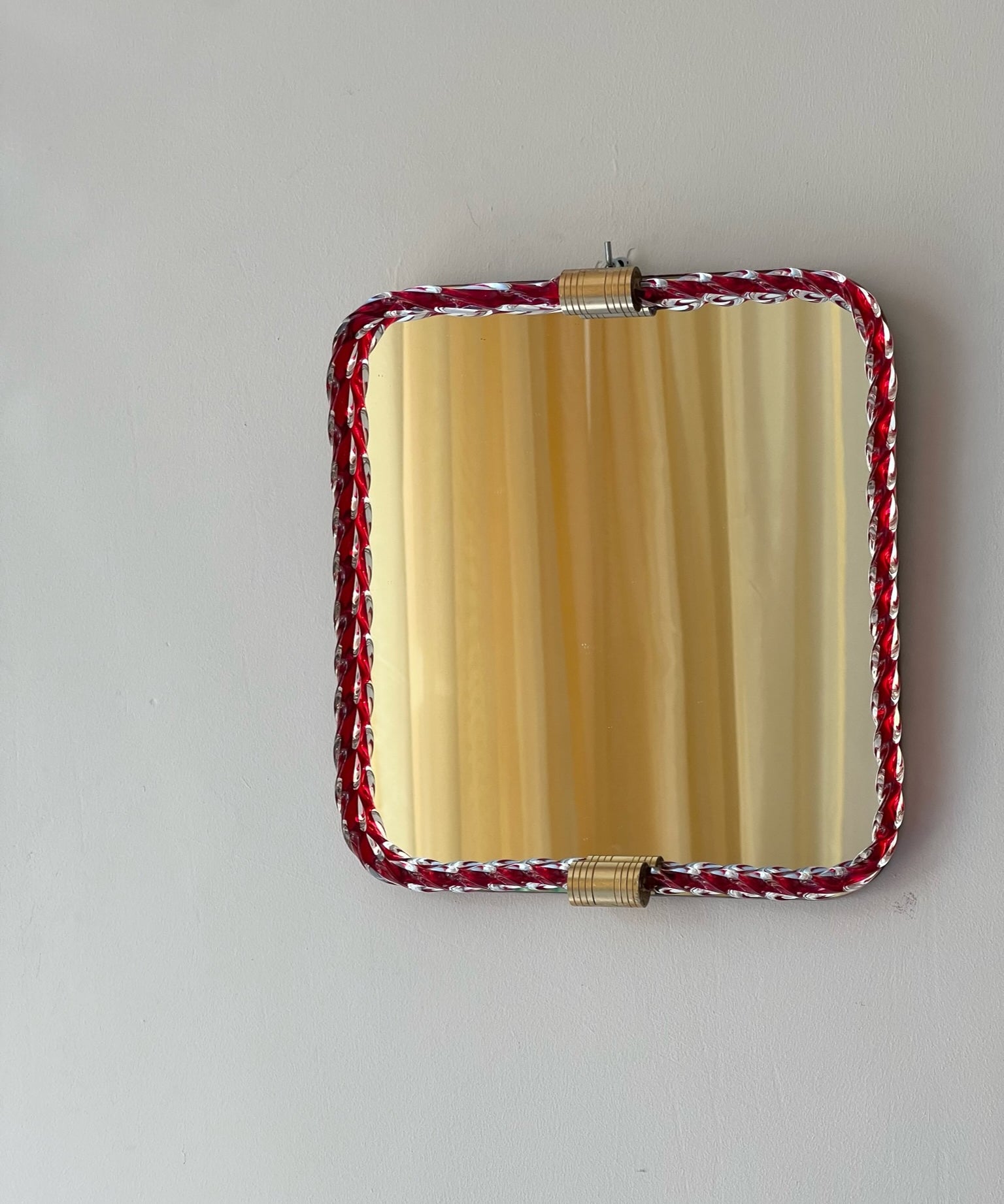 Vintage Italian mirror with red twisted clear glass frame